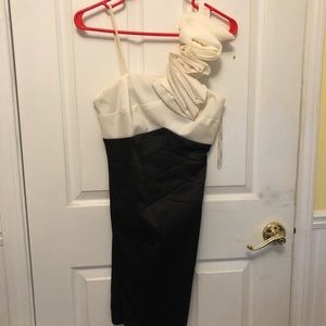 Cute asymmetrical dress with strap ruffles.